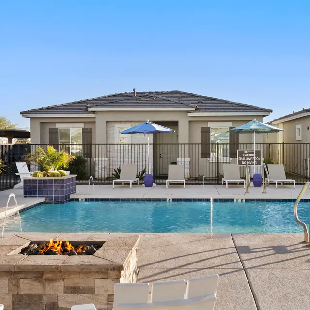 Resort-style pool and outdoor lounge area at The Farmhouse on Estrella in Goodyear, AZ