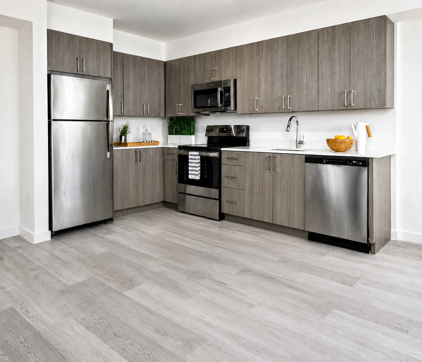 Modern Kitchen Design A modern kitchen featuring stainless steel appliances, gray wooden cabinets, and bright countertops.