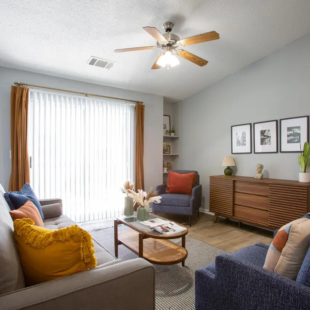 Renovated apartment living room, kitchen, and bedroom interiors with modern finishes at Centennial Crossing at Lenox Place
