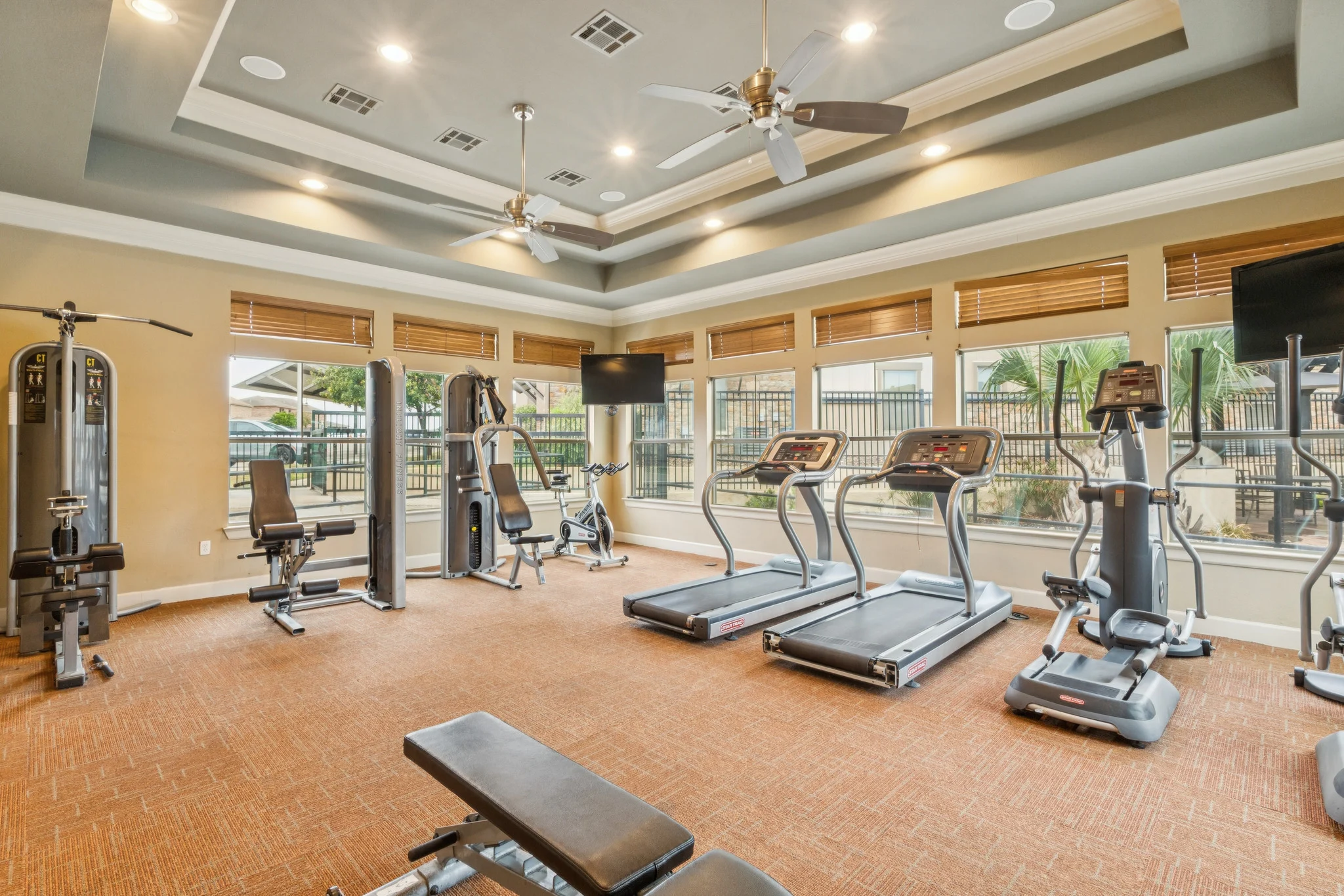 Modern Gym Interior Interior view of a modern gym with exercise equipment and large windows