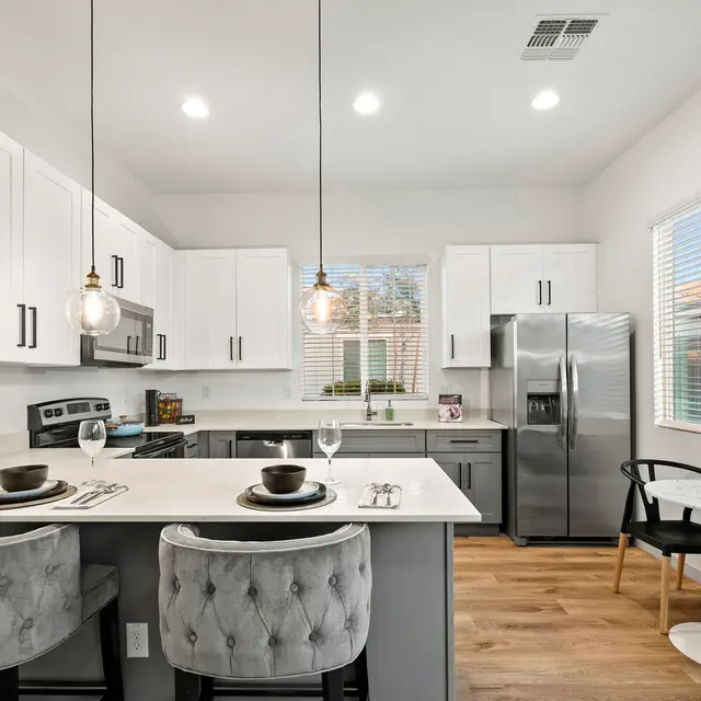 Spacious kitchen with pendant lighting and quartz countertops at The Farmhouse on Estrella