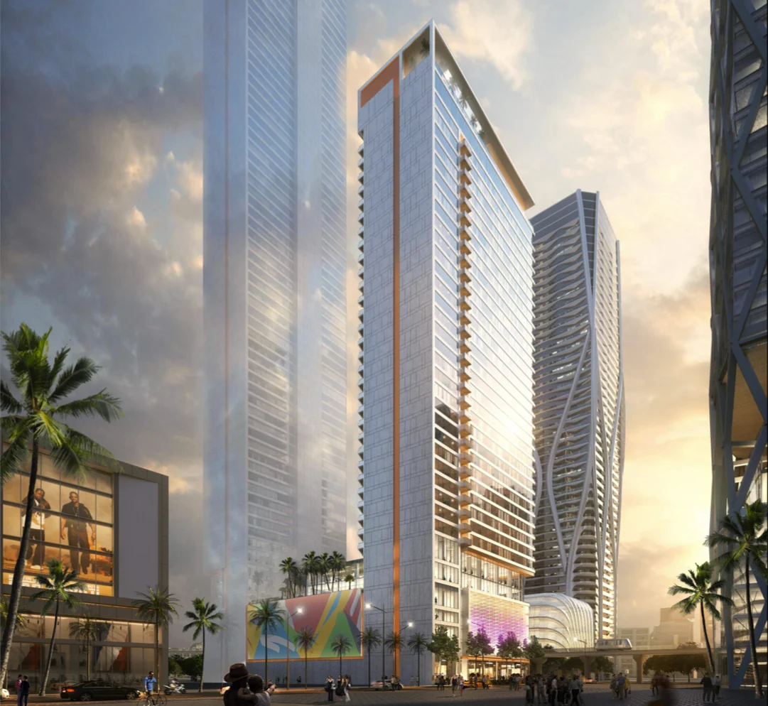 Contemporary Urban Architecture at Sunset A modern high-rise building with glass facades set against a sunset sky. Palm trees are in the foreground, and other skyscrapers are visible in the background.