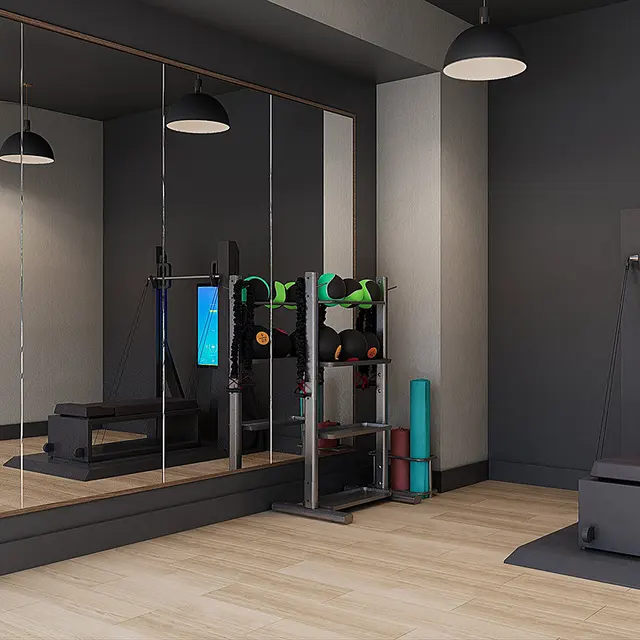 A stylish modern home gym with mirrors and workout equipment, featuring a sleek design and neutral tones.