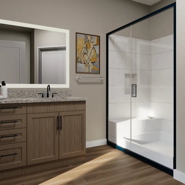 A modern bathroom featuring a wooden vanity with multiple drawers, a large mirror, and a glass shower enclosure. The shower has a sleek design with white tiles and a black frame. The room has light brown wooden flooring and a wall with an artistic decoration.