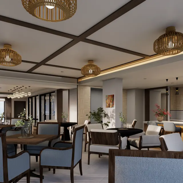 Interior of a modern restaurant featuring wooden furniture, stylish light fixtures, and a mix of seating arrangements.