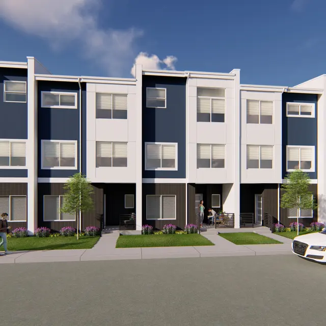Contemporary Row of Townhouses A contemporary row of townhouses featuring a mix of blue and white façades with a landscaped area in the front.