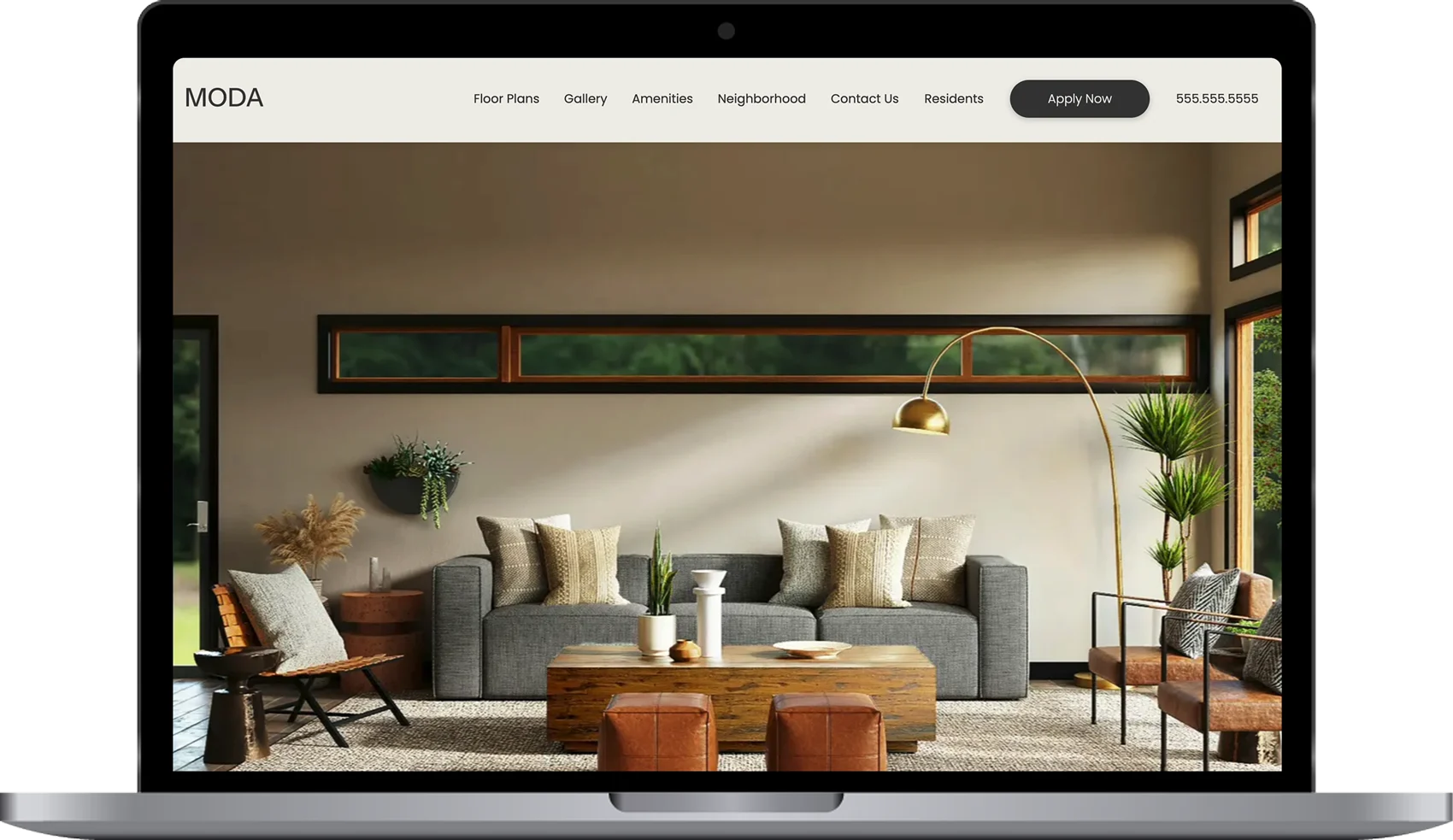 A modern living room showcased on a laptop screen, featuring a cozy gray sofa, wooden coffee table, and decorative plants, with a website layout for an apartment complex.