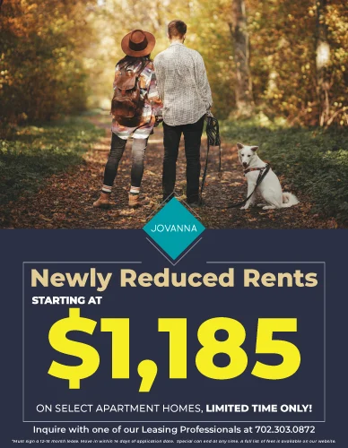 A couple walking down a wooded path with a dog. The advertisement highlights new rent prices for apartments with a starting price of $1,185.