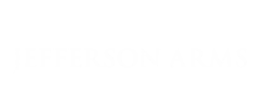 Logo for Jefferson Arms featuring intricate design and elegant font style.