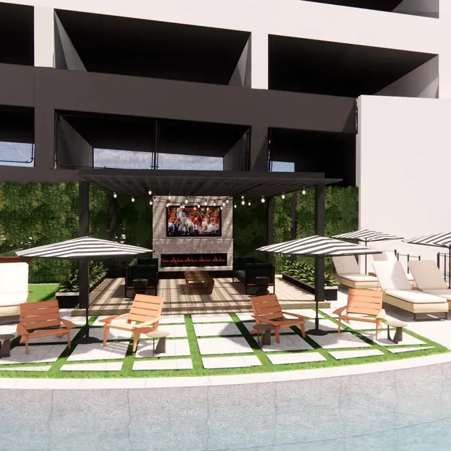 Chic Poolside Lounge Area A modern poolside lounge area with white loungers, green grass patches, and umbrellas, set against a backdrop of a multi-story building. A sign saying 'good vibes only' is visible.