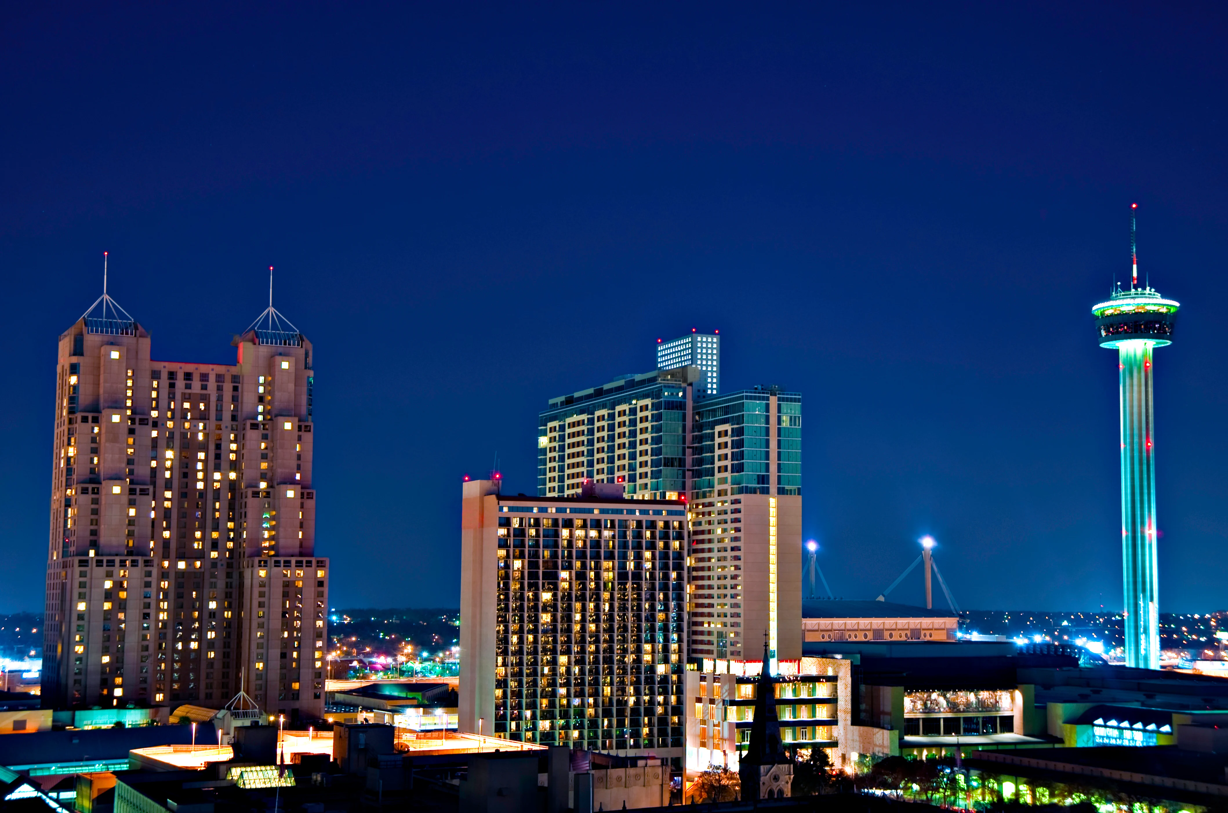 San Antonio Skyline at Night Night view of downtown San Antonio, Texas, featuring illuminated skyscrapers and the Tower Life Building.