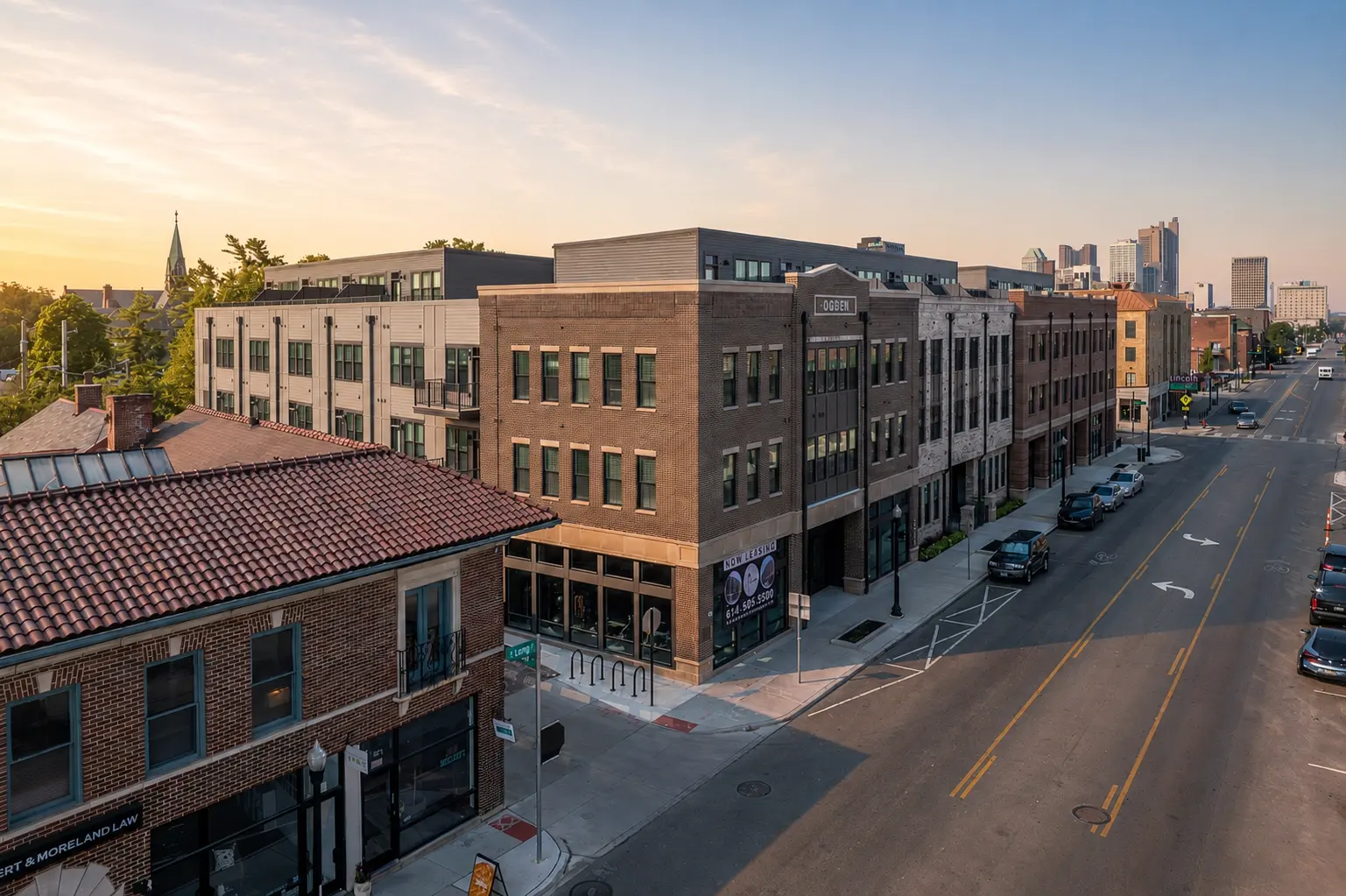 Aerial view of a mixed-use urban building during sunset