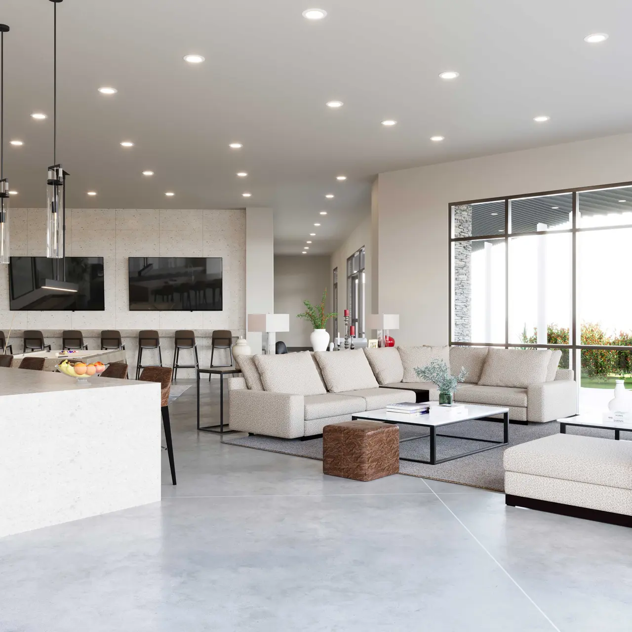 A spacious modern living area featuring a kitchen island with bar stools, comfortable sofas, and large windows allowing natural light in.