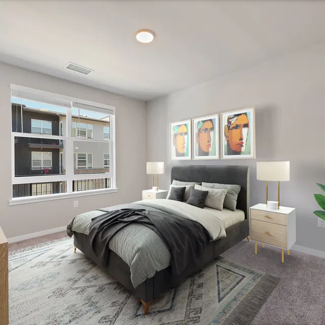 Modern Bedroom Interior Design A modern bedroom featuring a gray bedspread, bedside tables with lamps, and framed artwork on the wall. There is a large window with a view of the outside, and a plant in the corner. The room has a light gray color scheme and a cozy atmosphere.