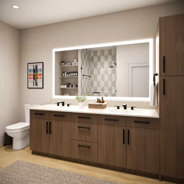 A modern bathroom featuring a wooden vanity with black fixtures, a large illuminated mirror, minimal decor including a potted plant, and geometric wall tiles.