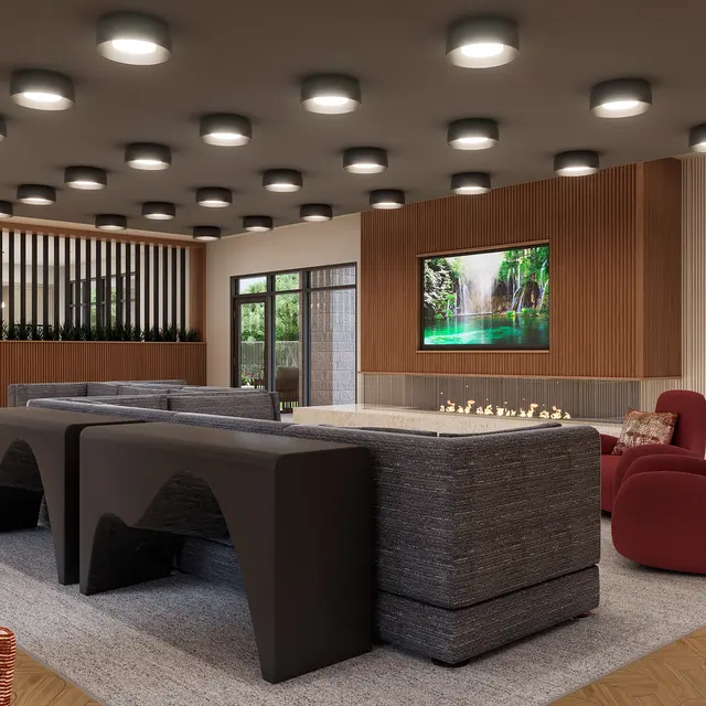 A modern living room featuring contemporary furniture, a large flat-screen TV, and a stylish decorative wall with plants.